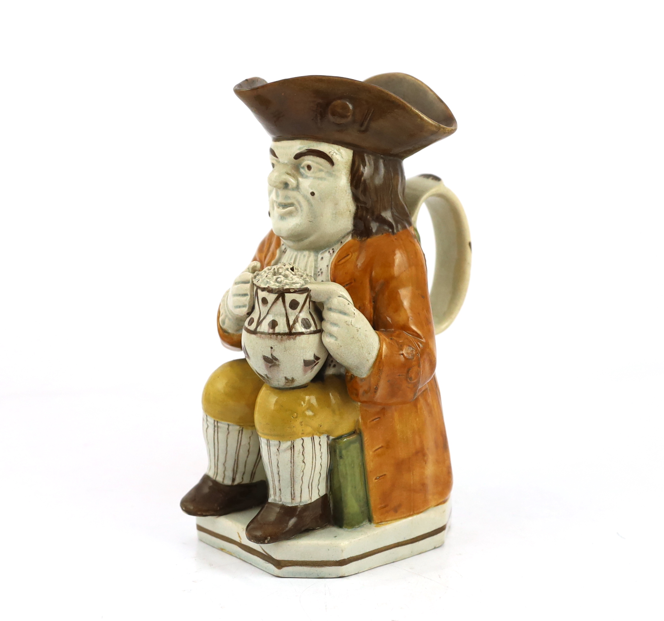 A Staffordshire Prattware Toby jug, c.1790-1800, restoration to front of hat